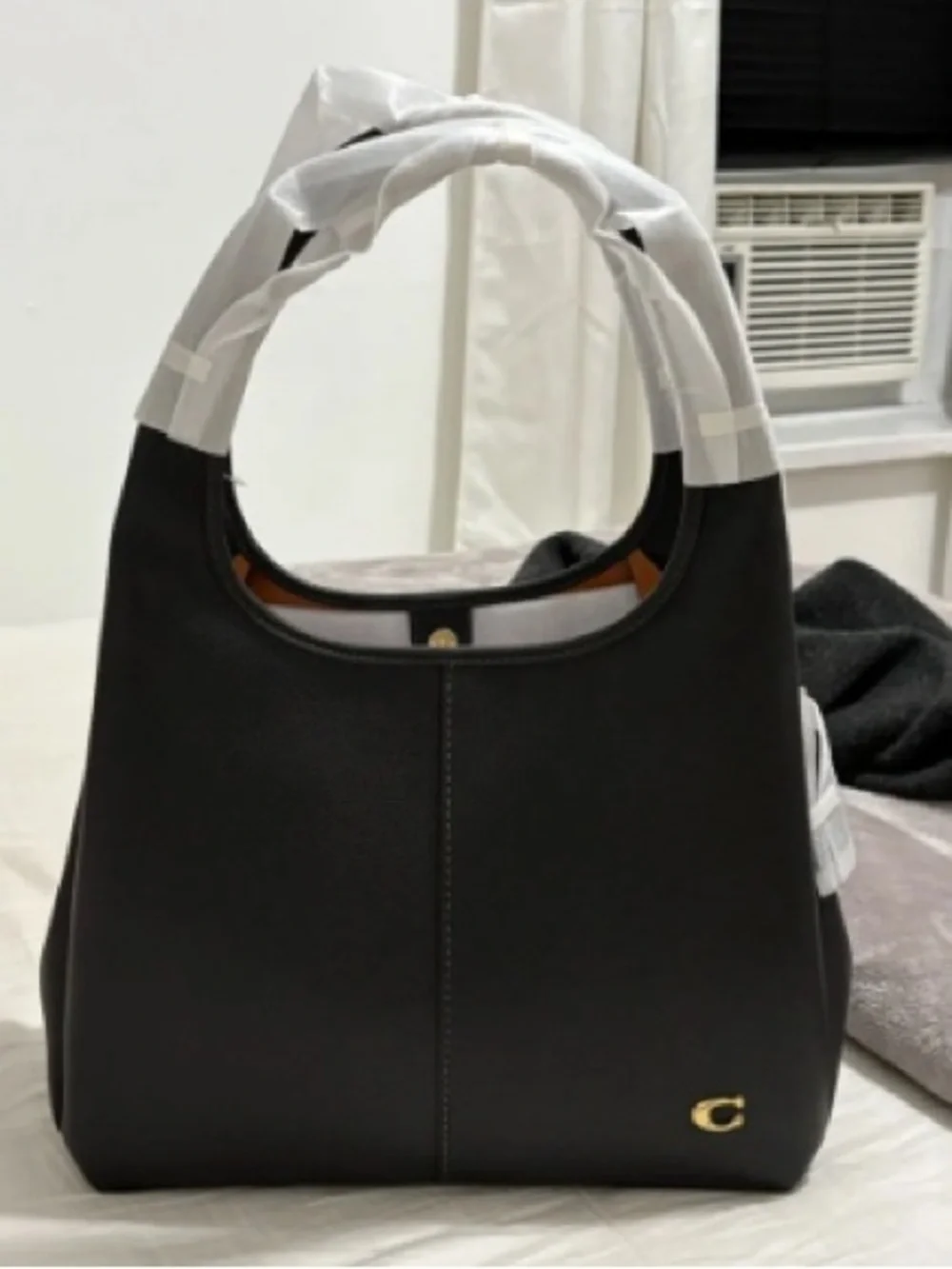 Coach Black Leather Shoulder Bag with Gold 'C' Accent